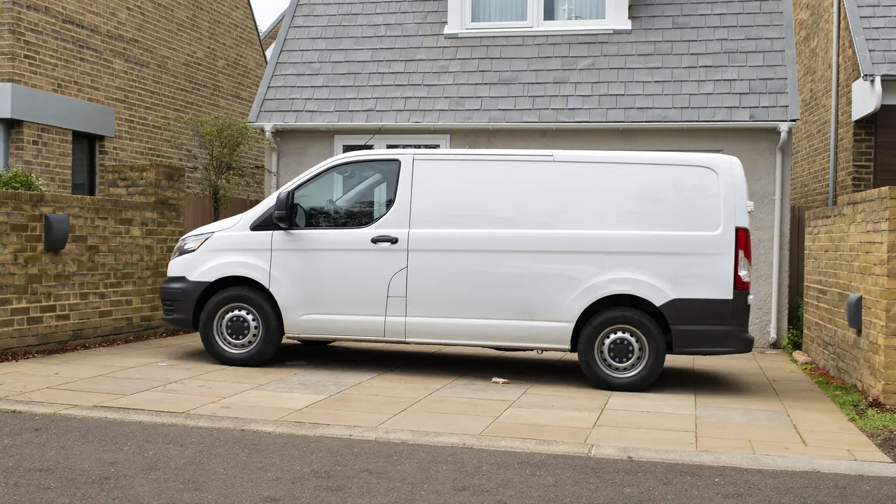 A local window company van parked outside a UK home during a fitting