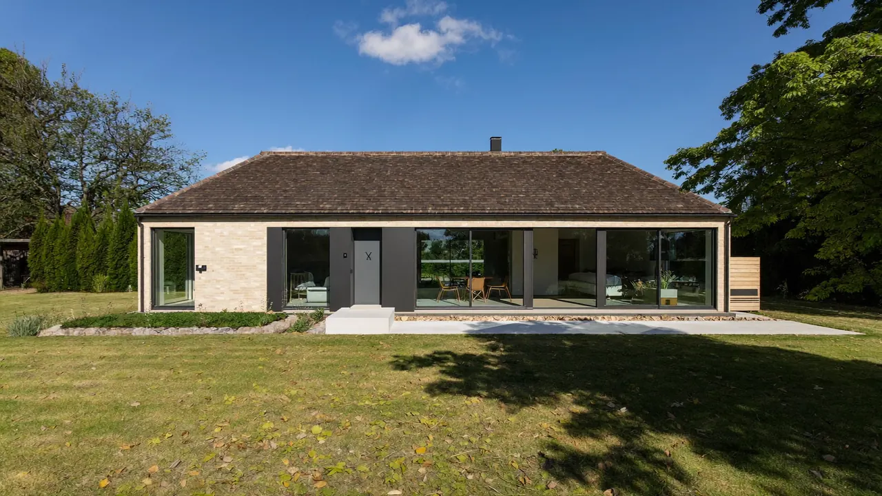 Exterior of a UK detached house fitted with new double-glazed windows