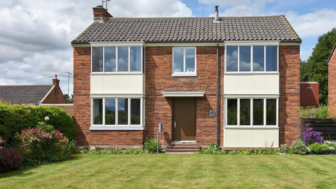 A UK semi-detached home with newly fitted white double-glazed windows